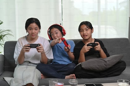 Footage of Young Asian esport woman gamers playing online video games on  the computer with neon light at home. Attractive girl gaming player feels  enjoy technology broadcast live streaming. 25213471 Stock Video