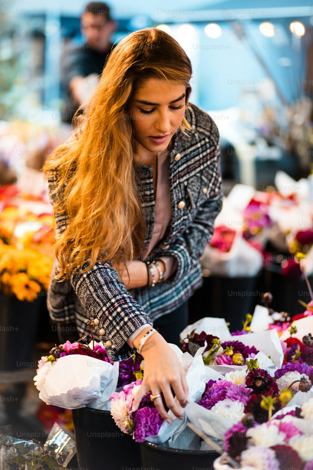 Woman in the garden center. Focus is on woman.