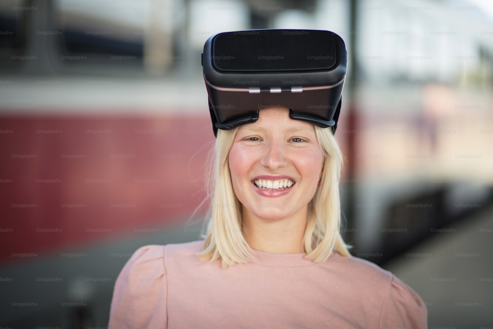 Woman on bus station. Young woman touching experiencing VR helmet.