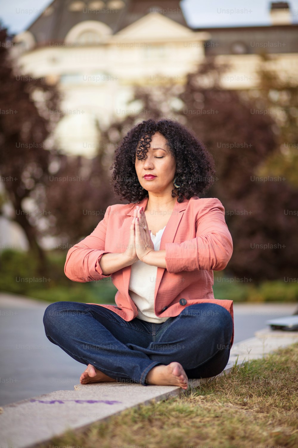 Business woman working yoga on the street.