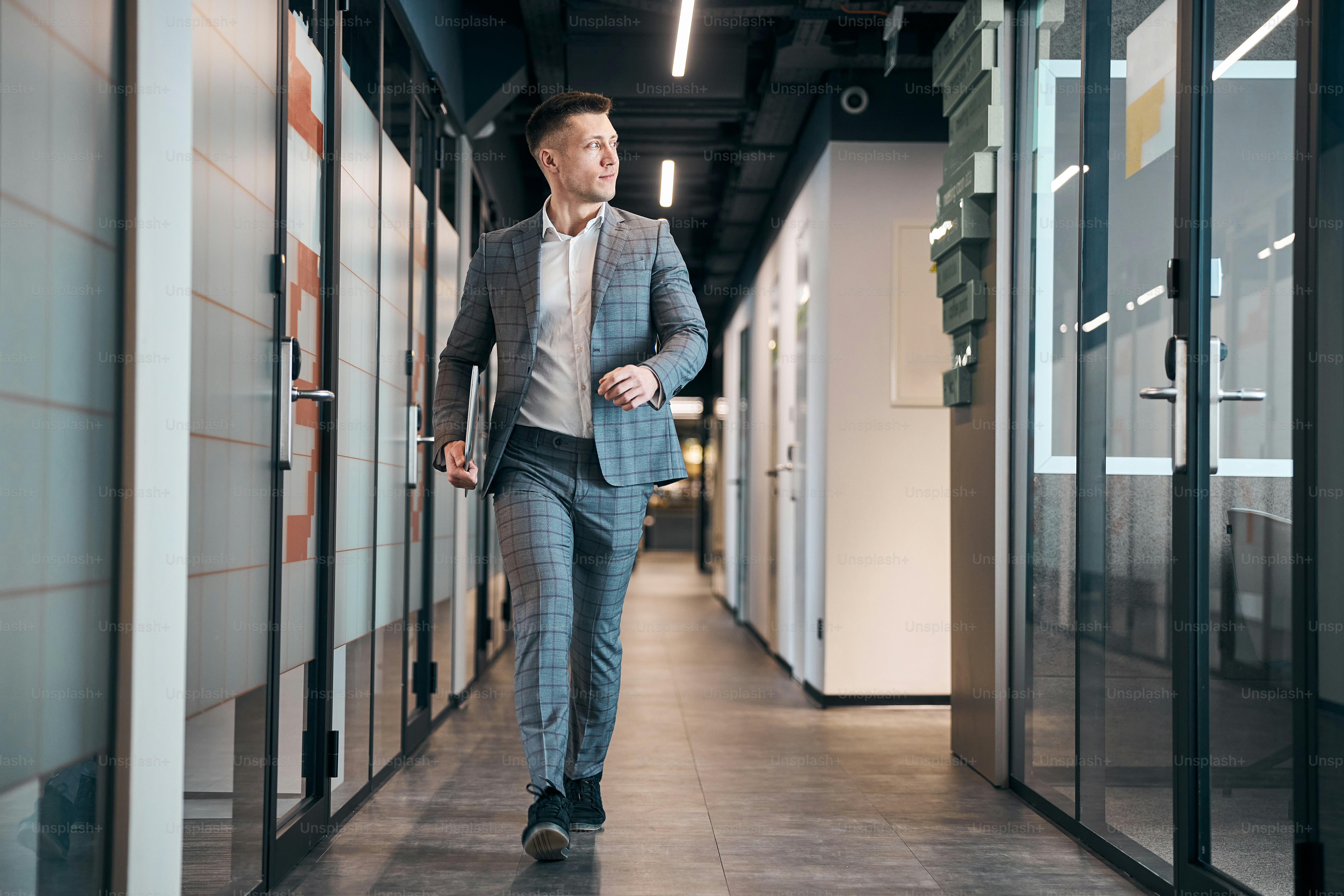 Person taking a walk to ease walking for back pain after sitting at a desk