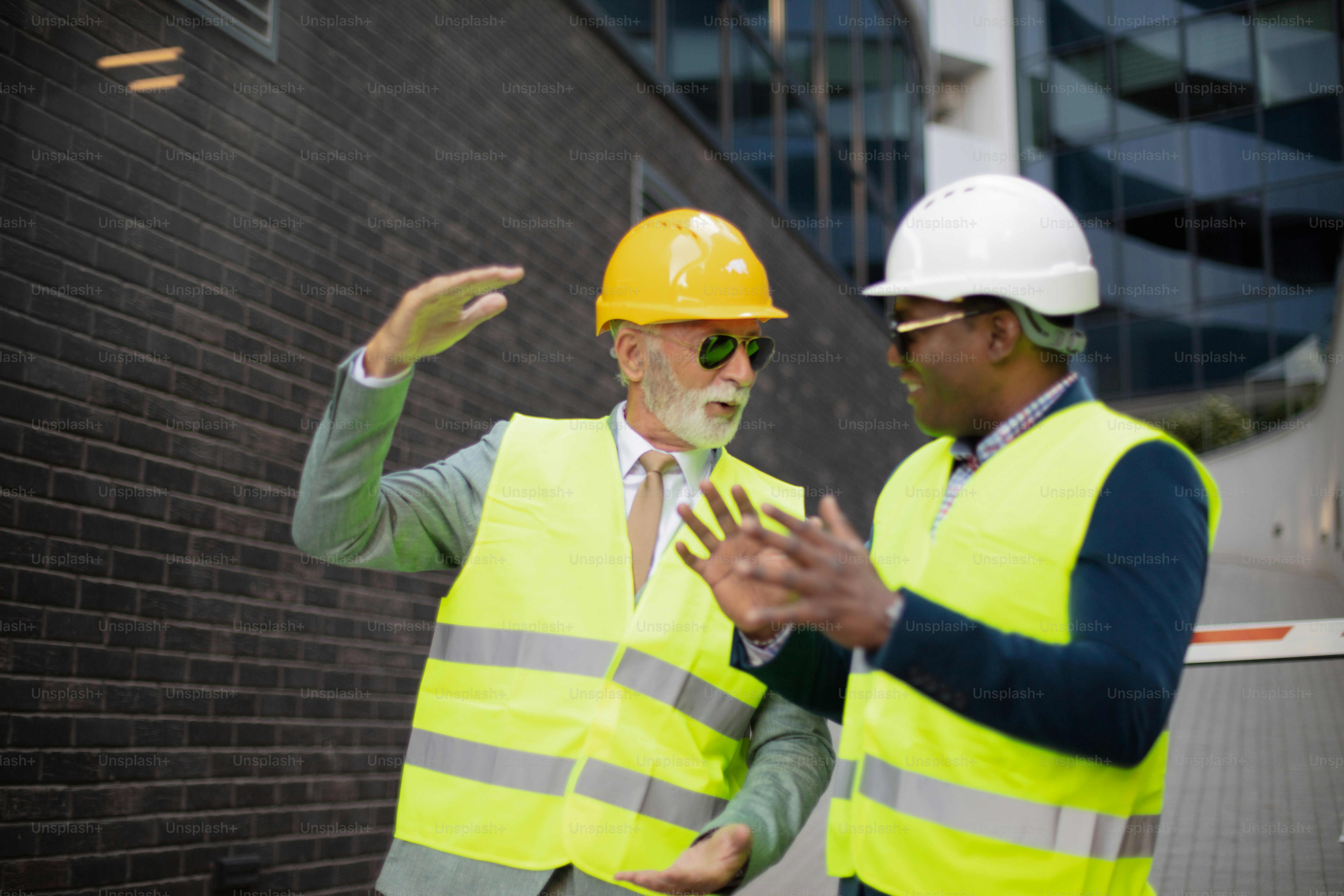 Engineer discussing the structure of the building with architects ...