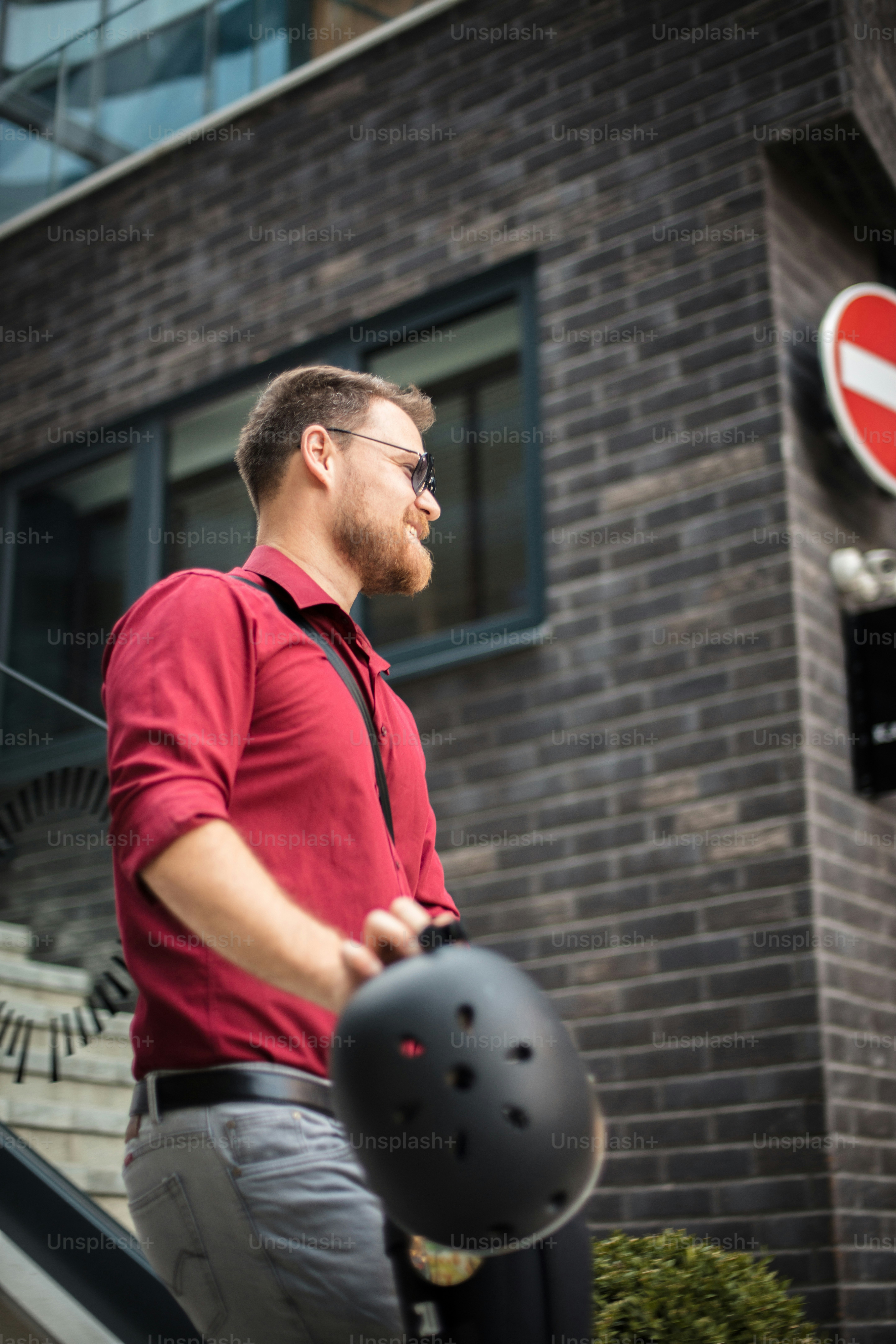 Business man riding electric scooter in the city.