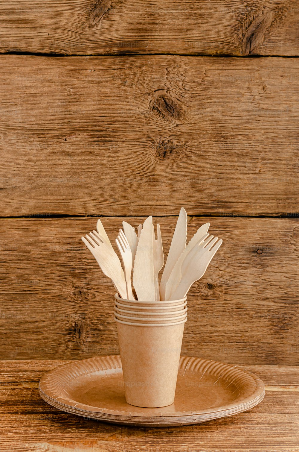 Zero waste tableware set for picnic on wooden background. Environmental consciousness concept. Copy space