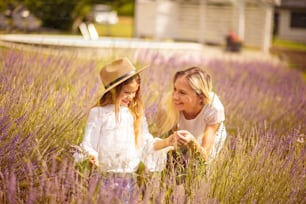 Mother and daughter  in lavender field.