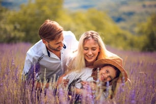 Portrait of smiling family in lavender field.