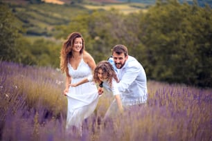 Happy family in lavender field.