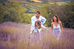Happy family in lavender field.