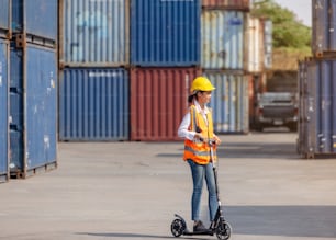 women worker with scooter area containers outdoors.
