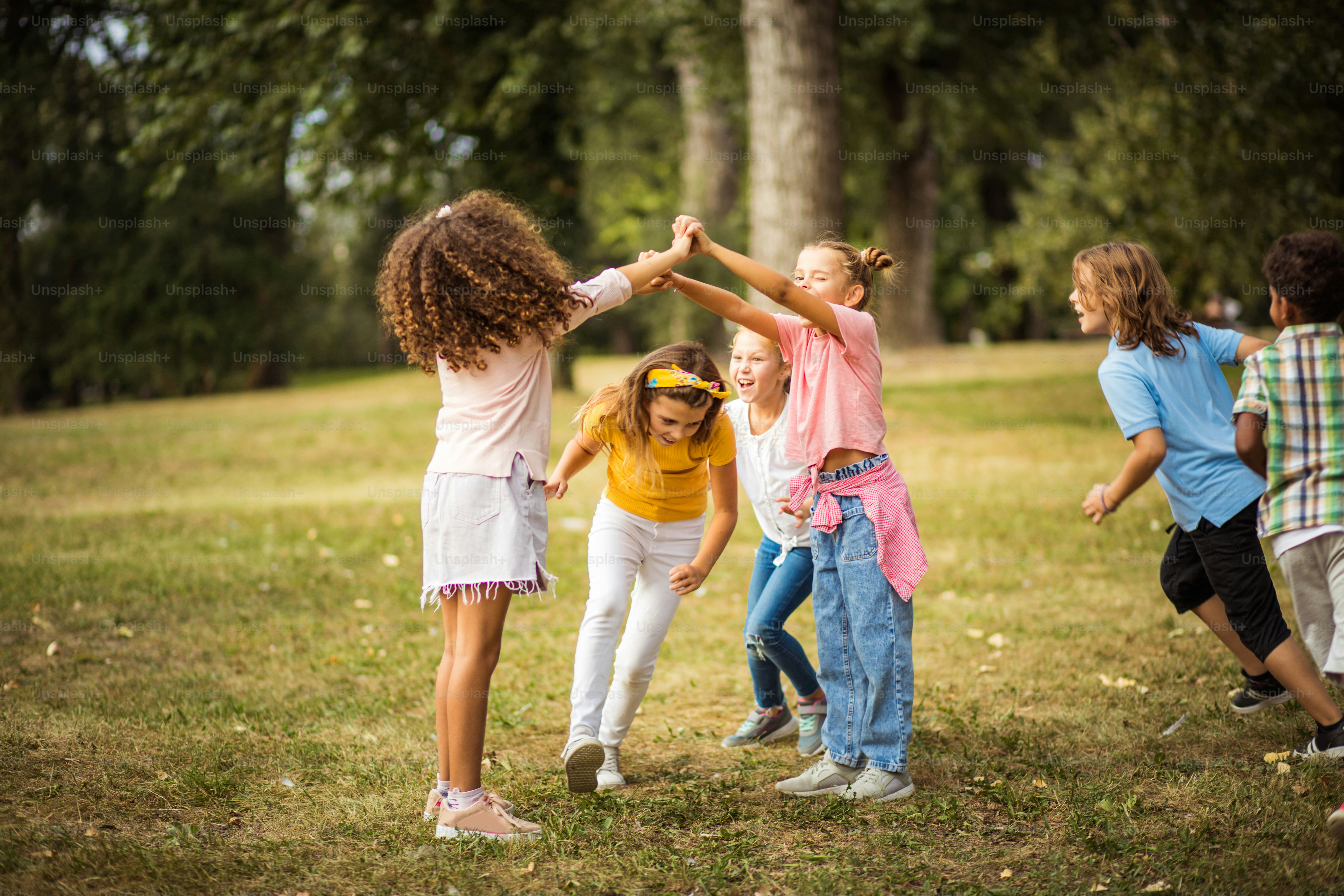 Large group of school kids having fun in nature