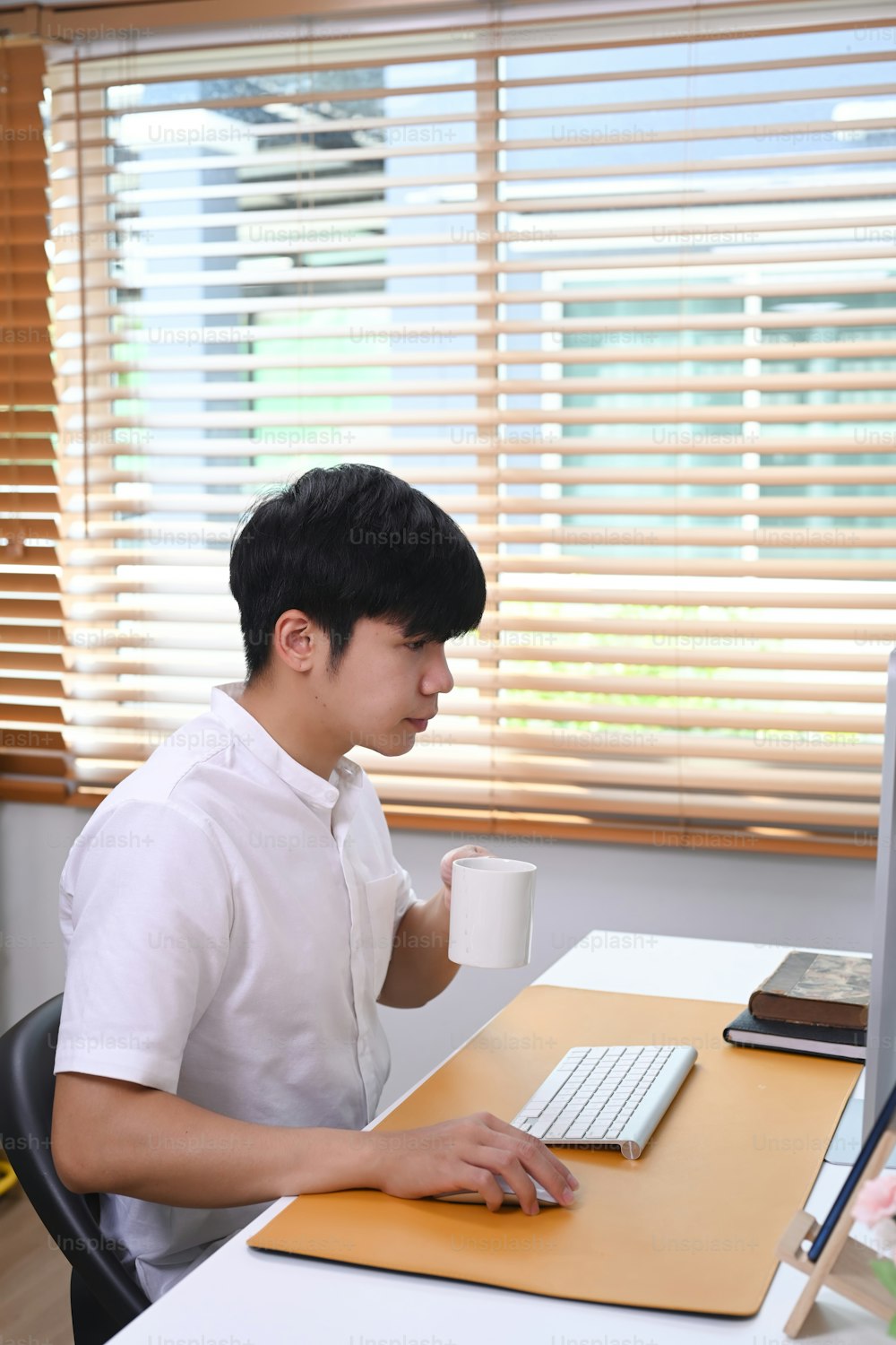 Young man employee concentrate working in comfortable workplace.