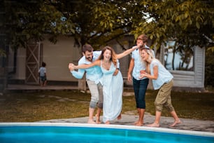 Friends having fun by the pool.