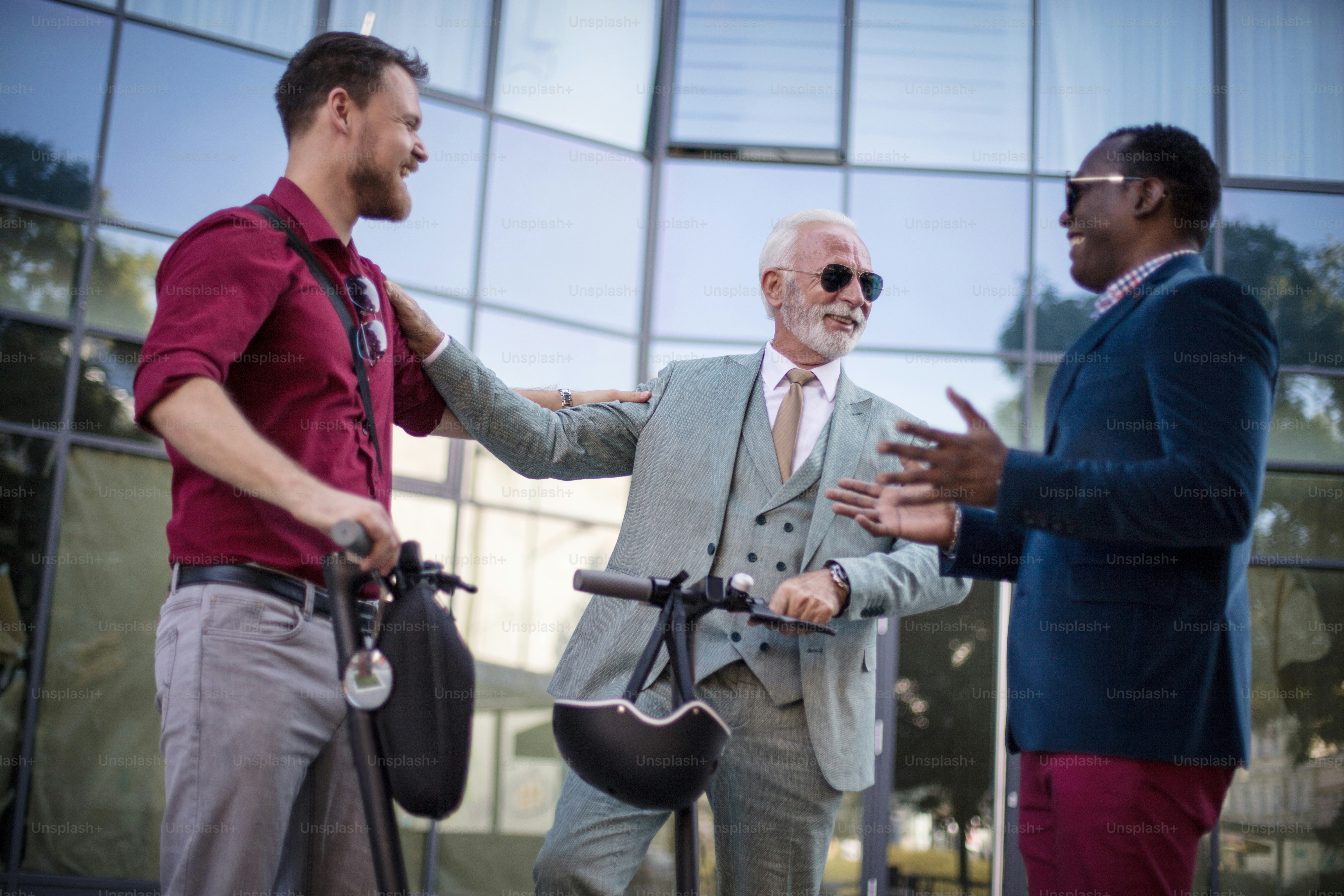 Coworkers. Small Group of business men talking on the street.