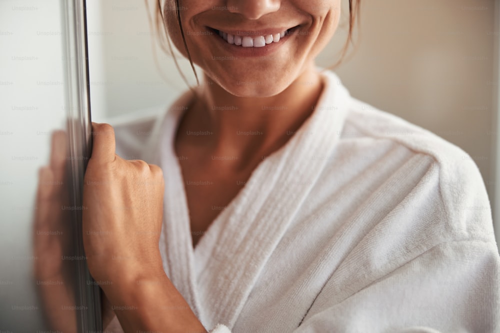 Cropped head front view portrait of charming elegant happy woman with beautiful smile in room indoors