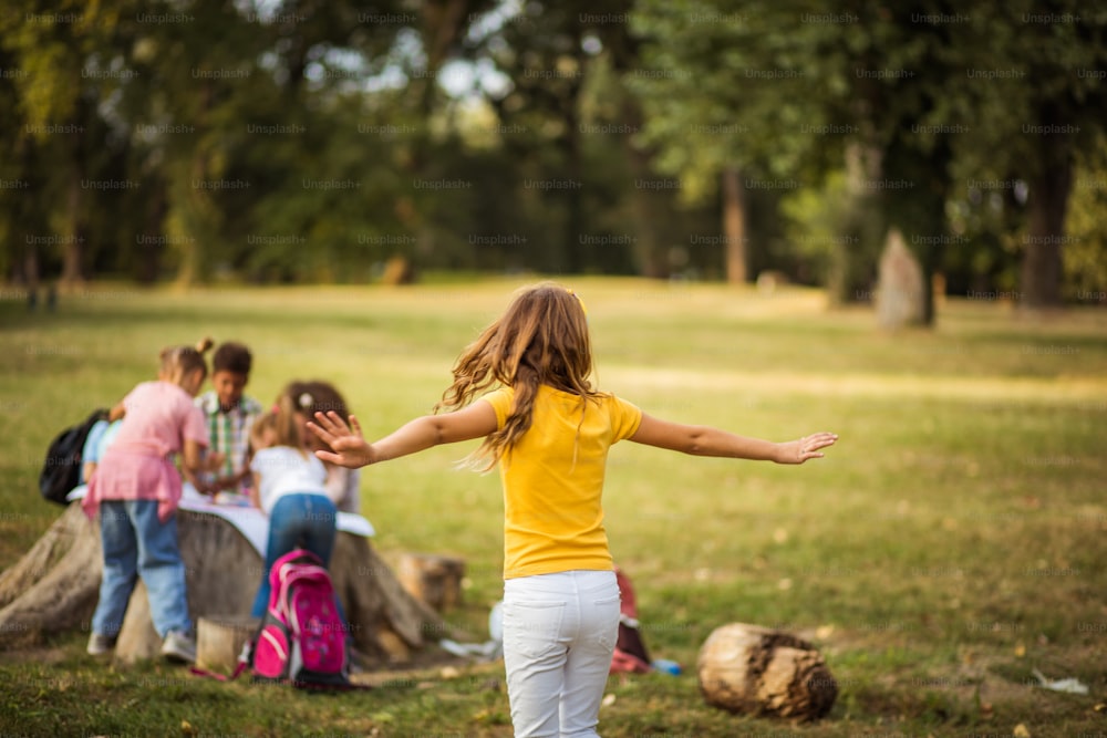 Large group of school kids in nature.