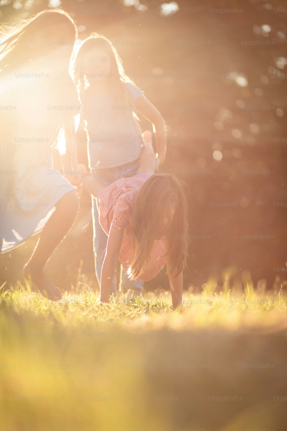 Nature and friends, fun guaranteed. Three little girl spending time outside and playing.