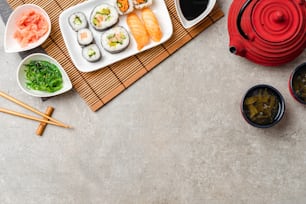 Japanese sushi with soy sauce, ginger and algae salad