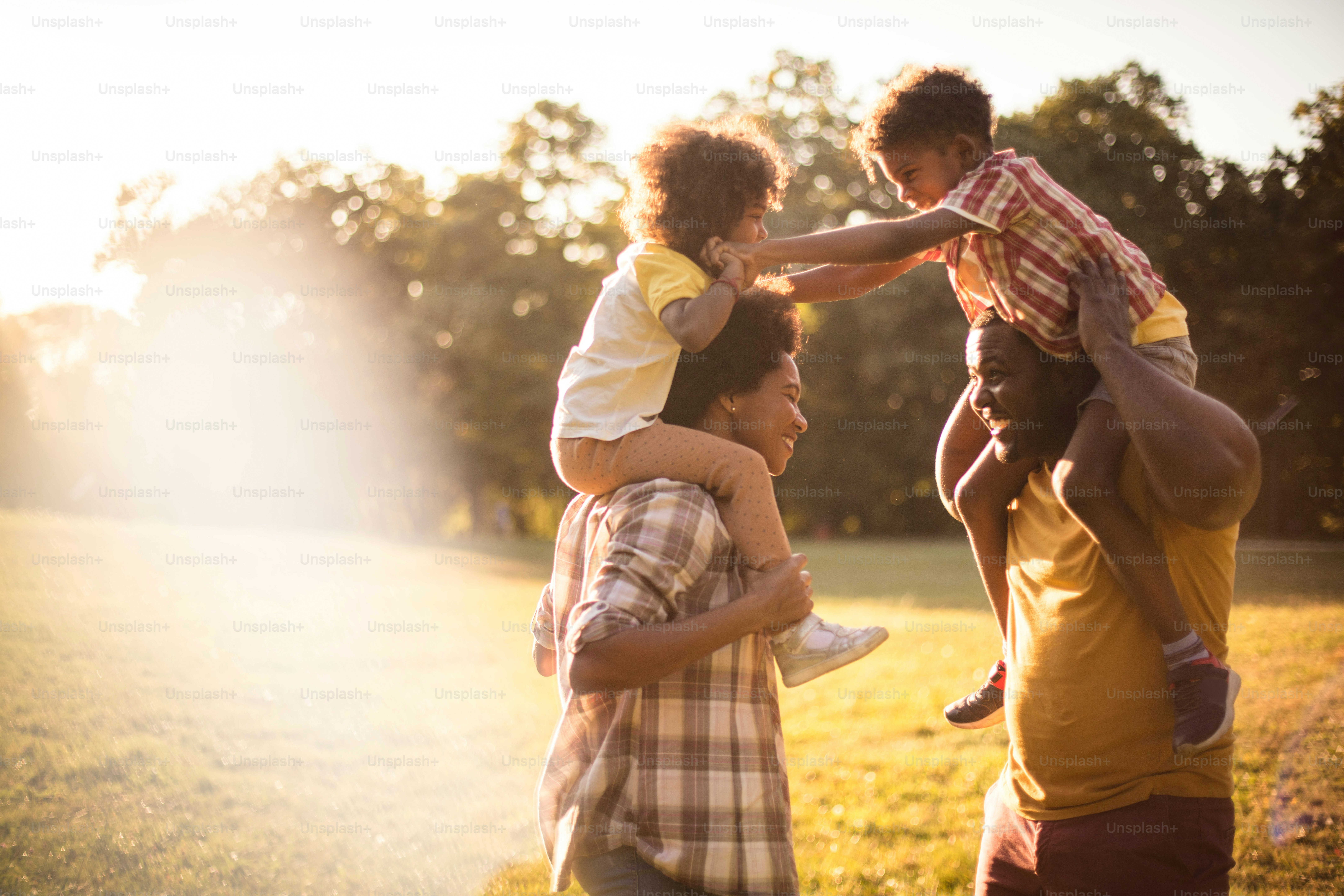 African American family having fun in nature. Close up.