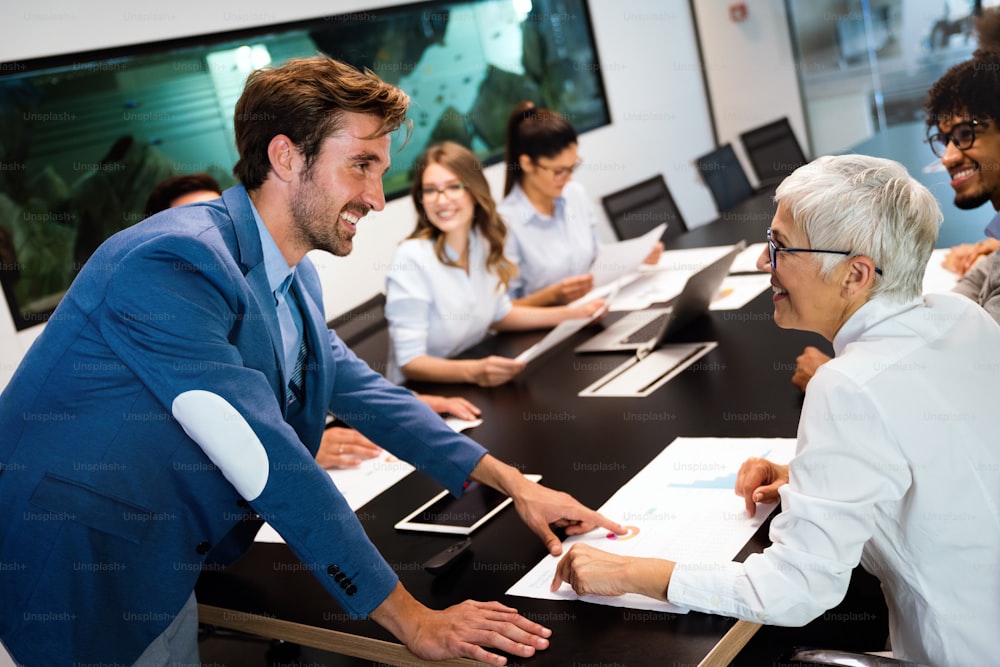 Group of diverse business people working at busy modern office