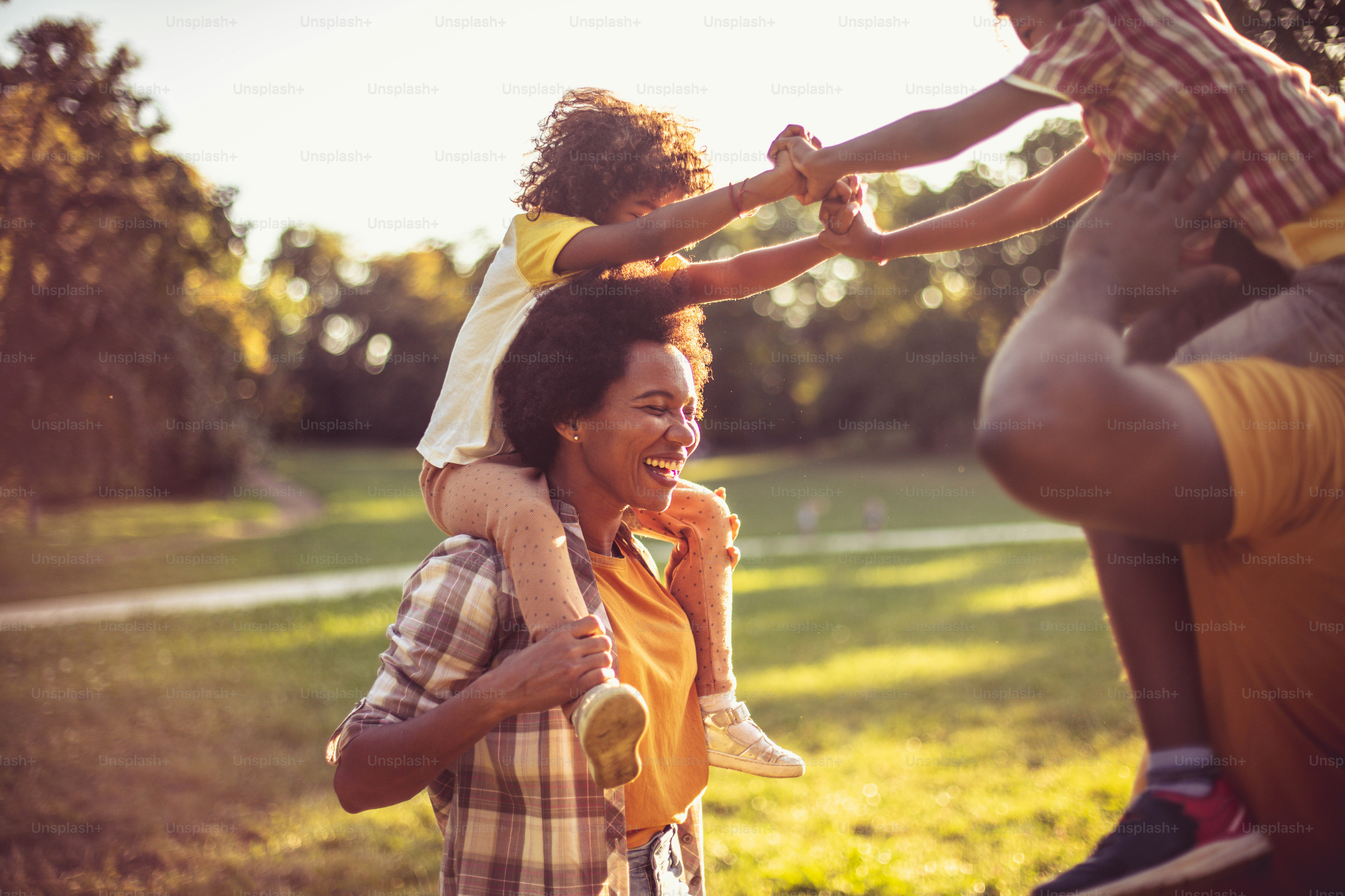 African American family having fun in nature. Close up.