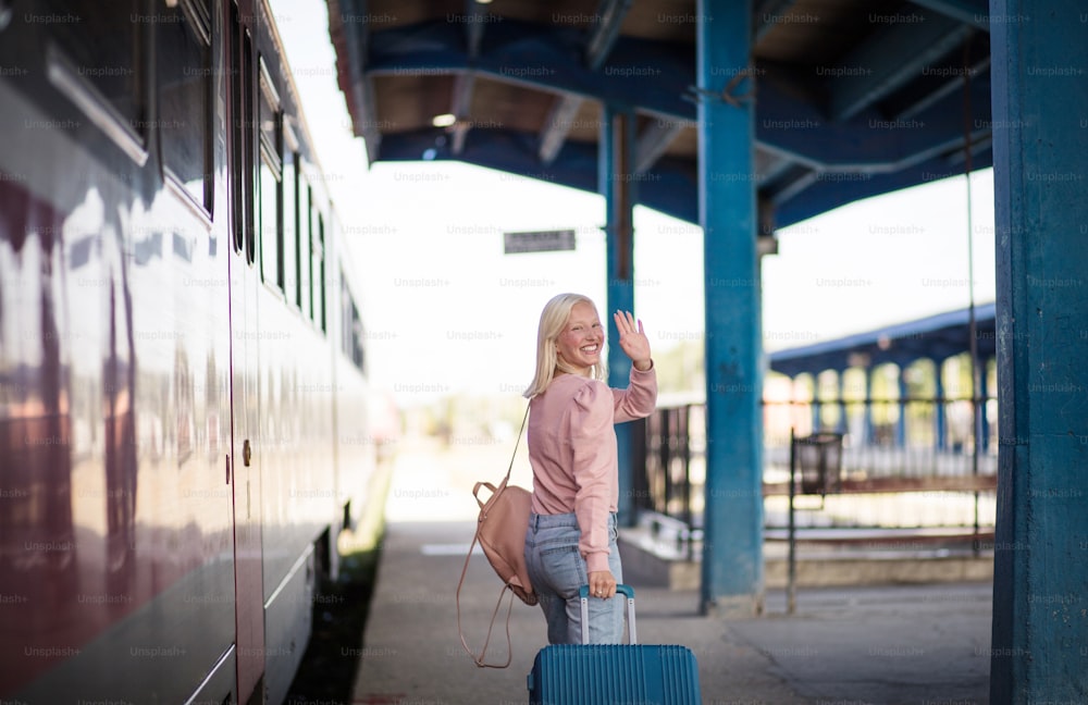 Young woman with suitcase going on vacation.