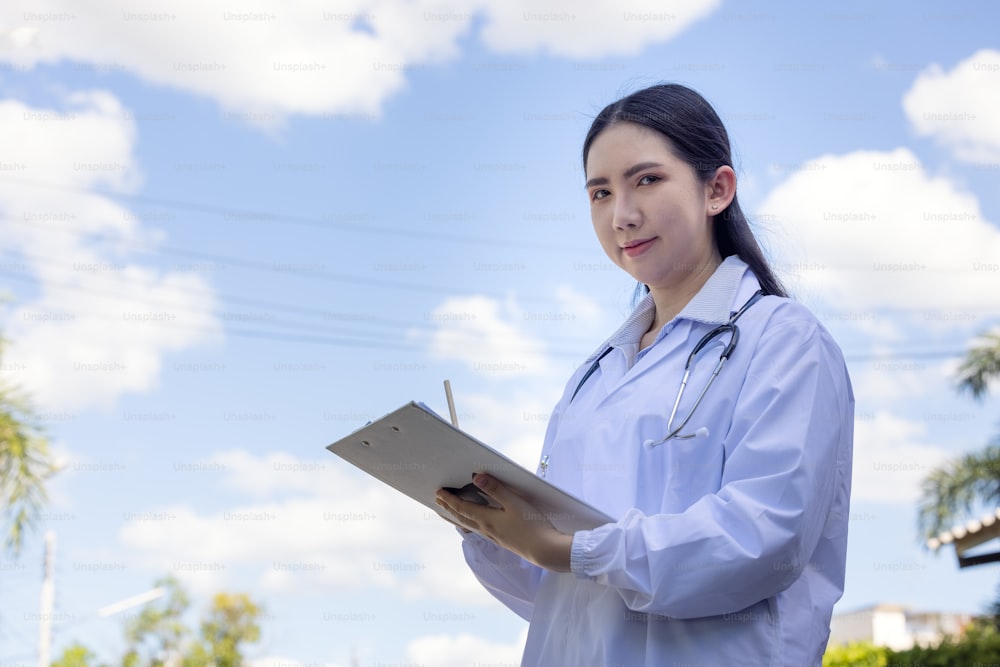 Doctors reviewing medical documents outdoors