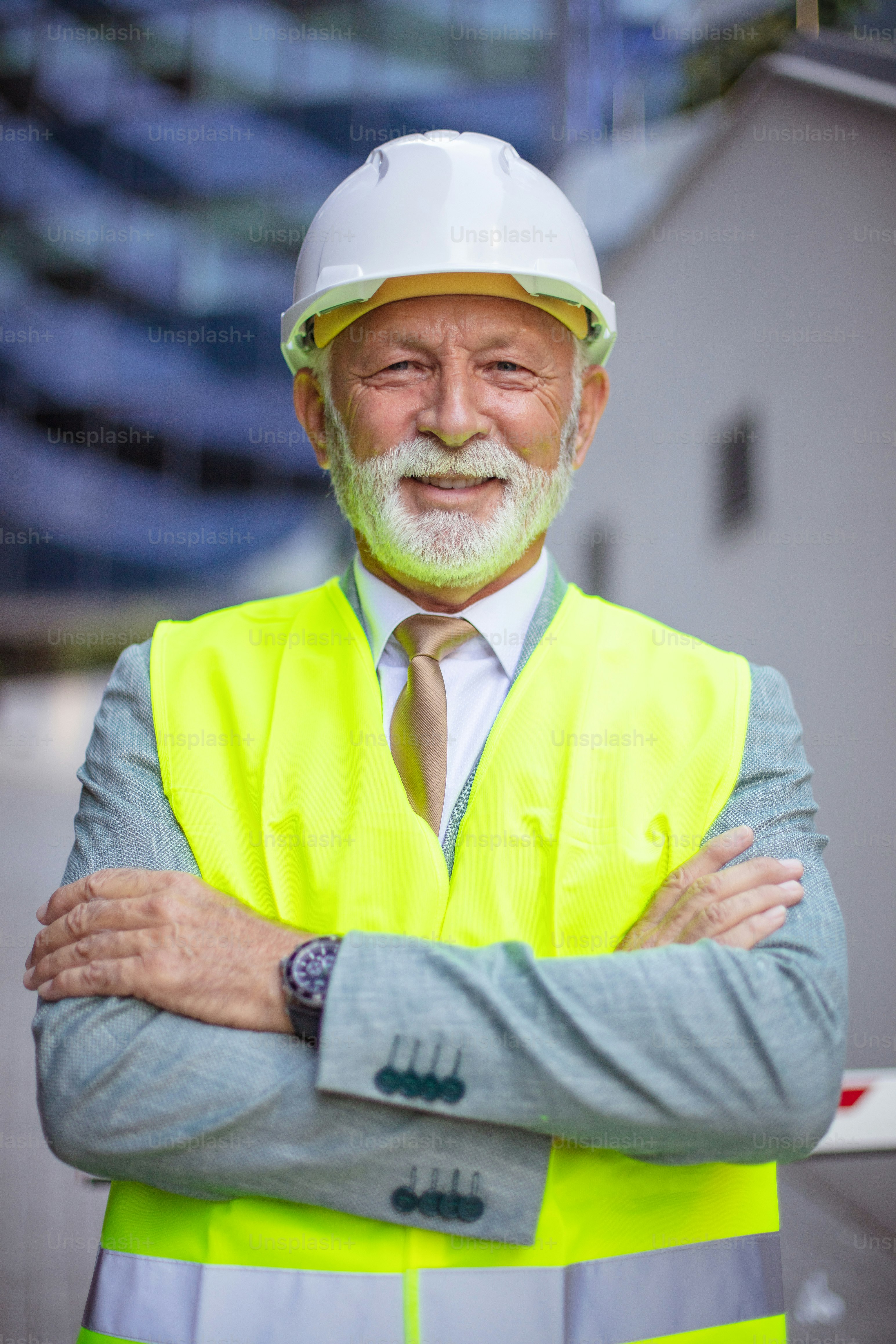 Senior engineer standing on the street. Looking at camera.