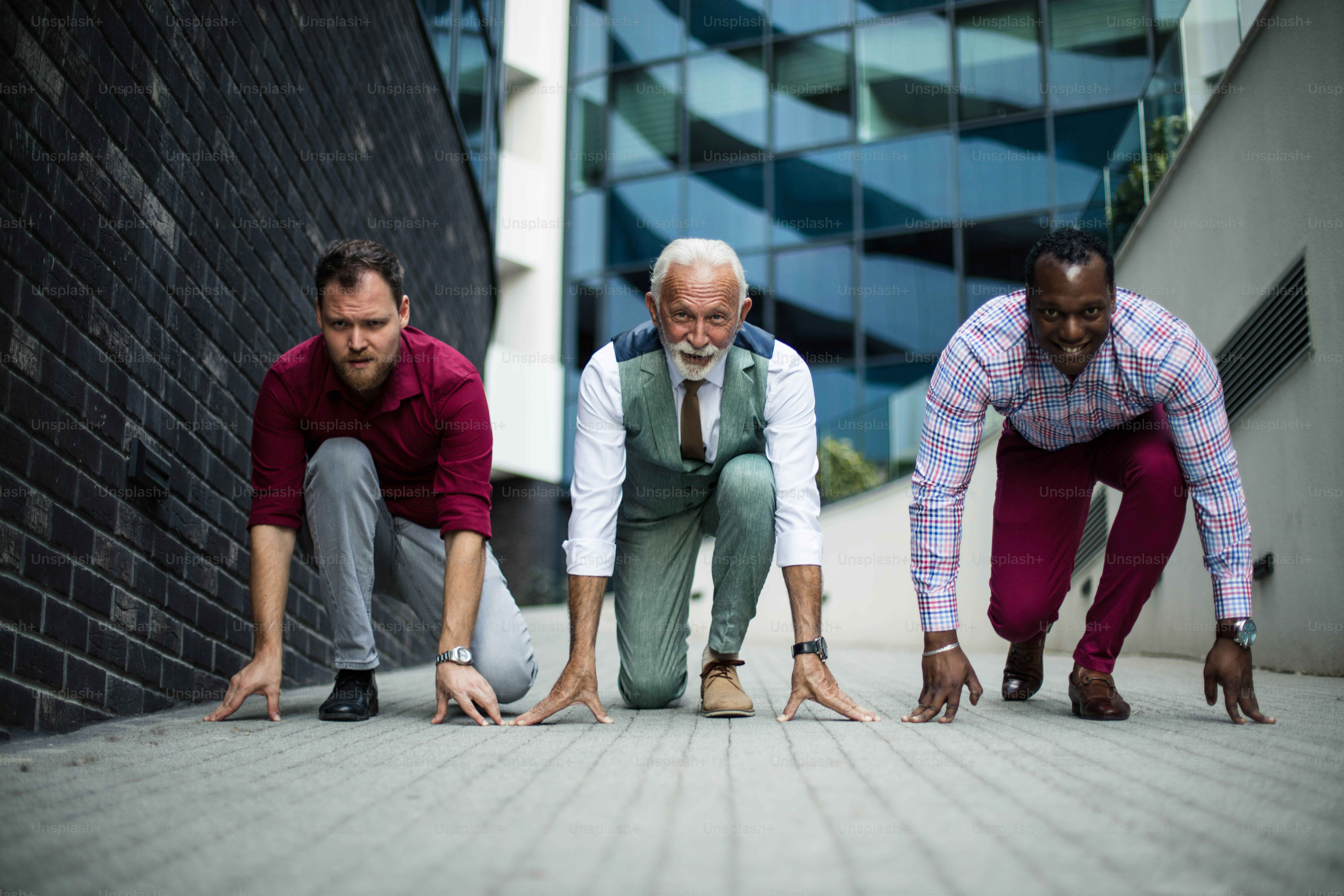 Only one can be a winner. Three business men outside preparing for rice.
