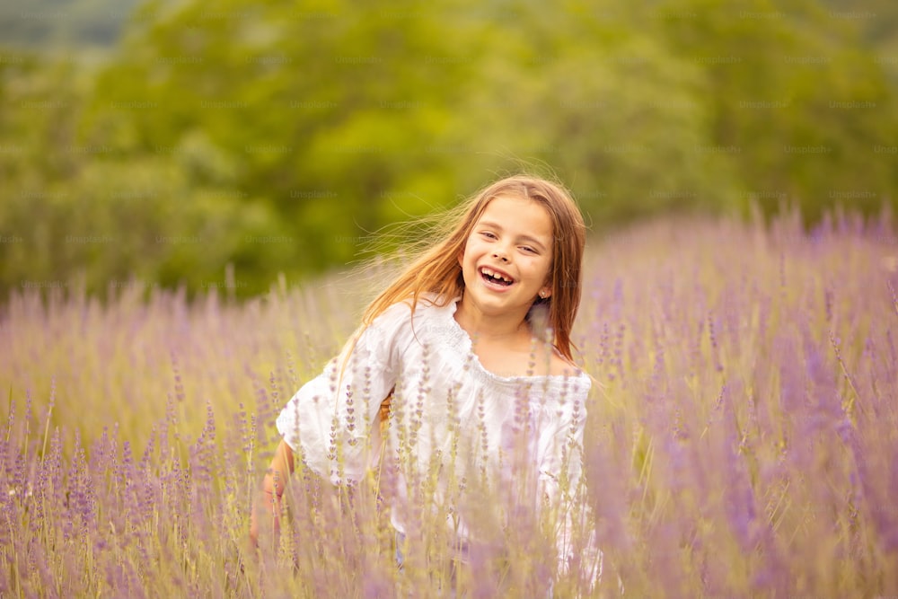 Smiling little girl in lavender field.
