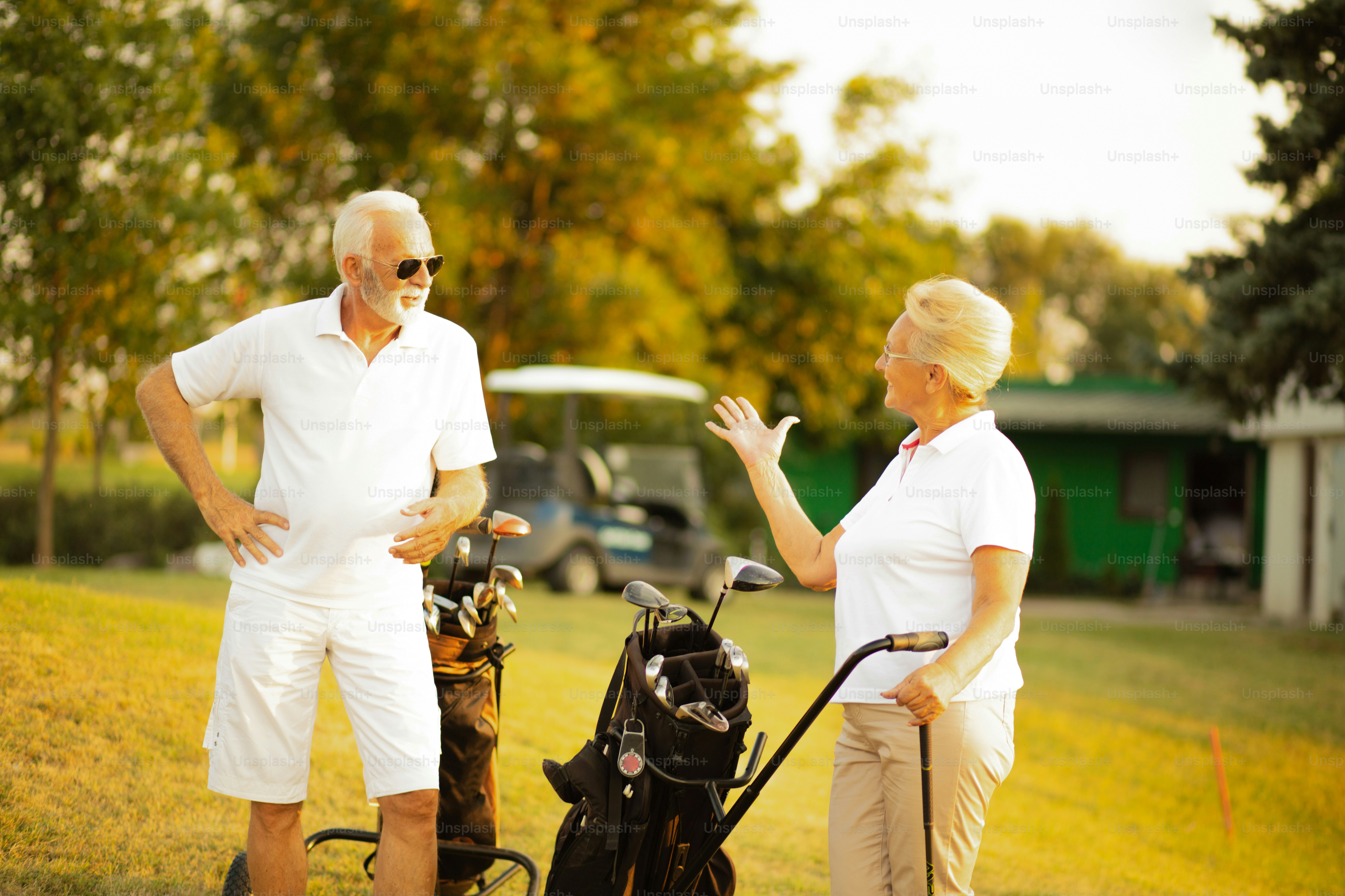 Seniors golfers on the filed talking.