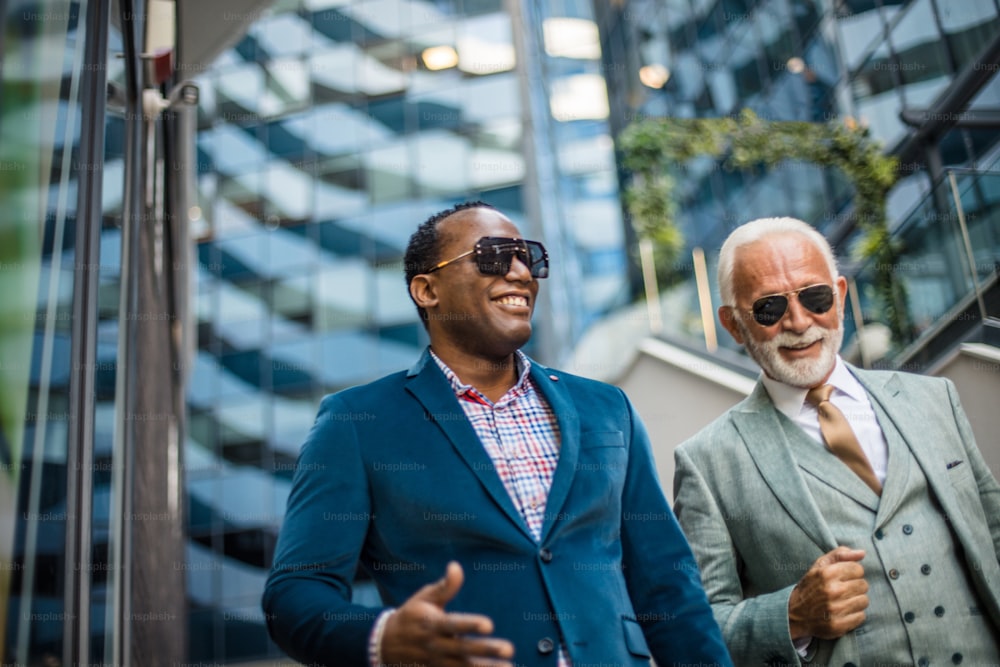 Two business men talking on the street.