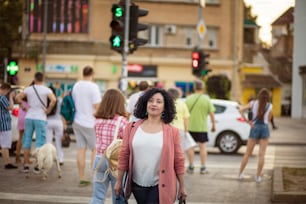 In city is always crowded. Business woman walking on the street.