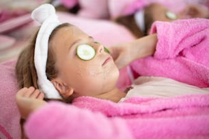 Little girl having a treatment for face.