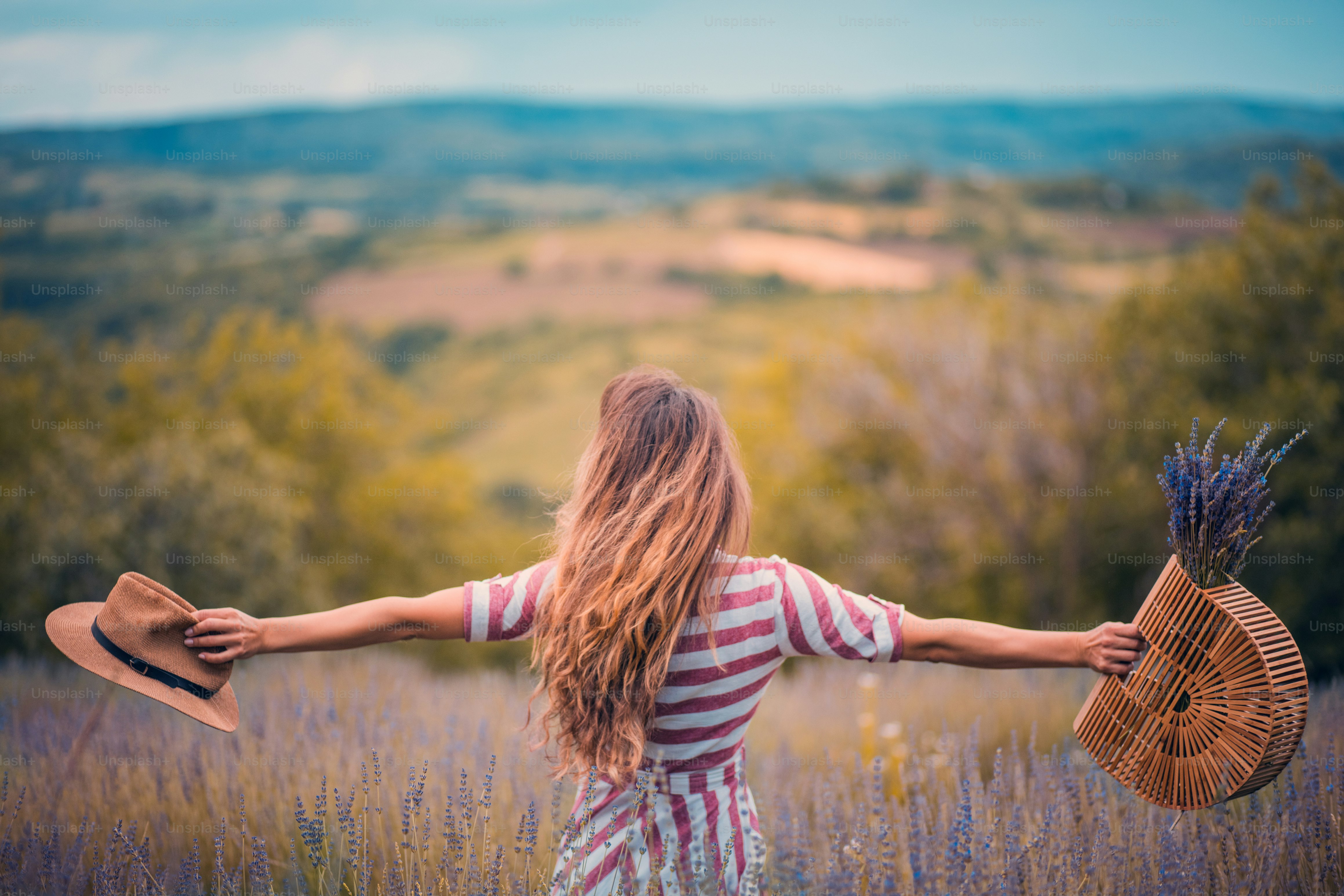Young Woman dancing in lavender filed.