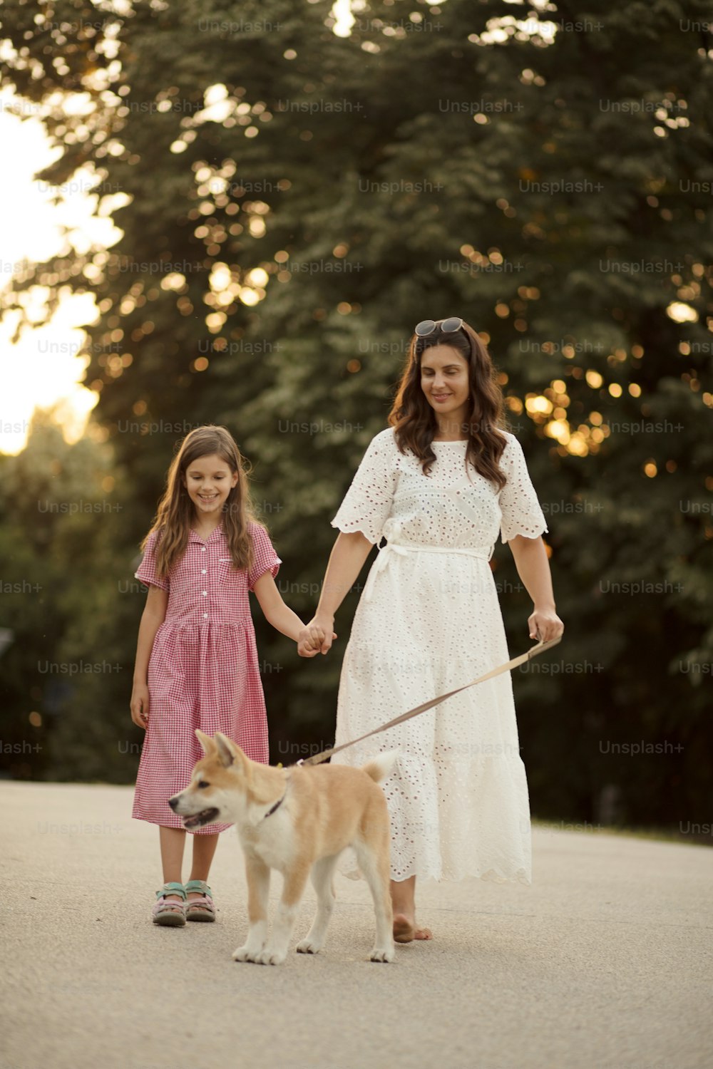 Mother and daughter with their dog.