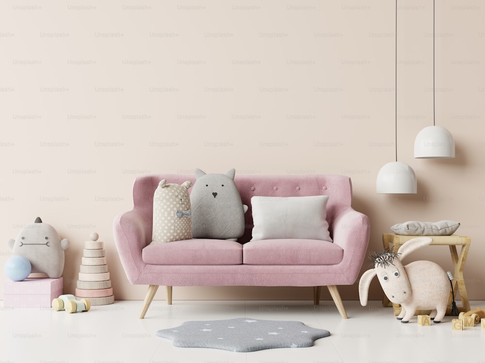 Maqueta de pared en la habitación de los niños con sofá rosa sobre fondo de pared blanco vacíoRenderizado .3D