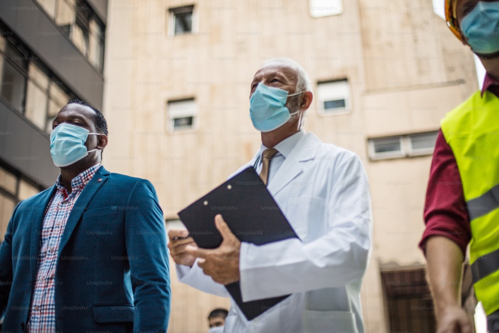 Business man, doctor and engineer walking trough street