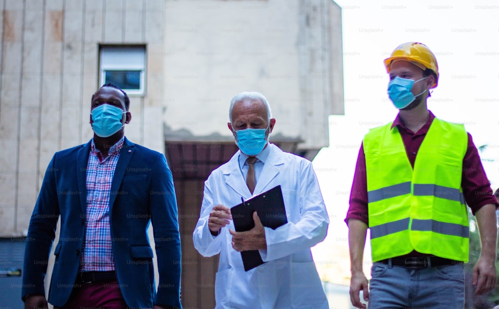 Business man, doctor and engineer walking trough street