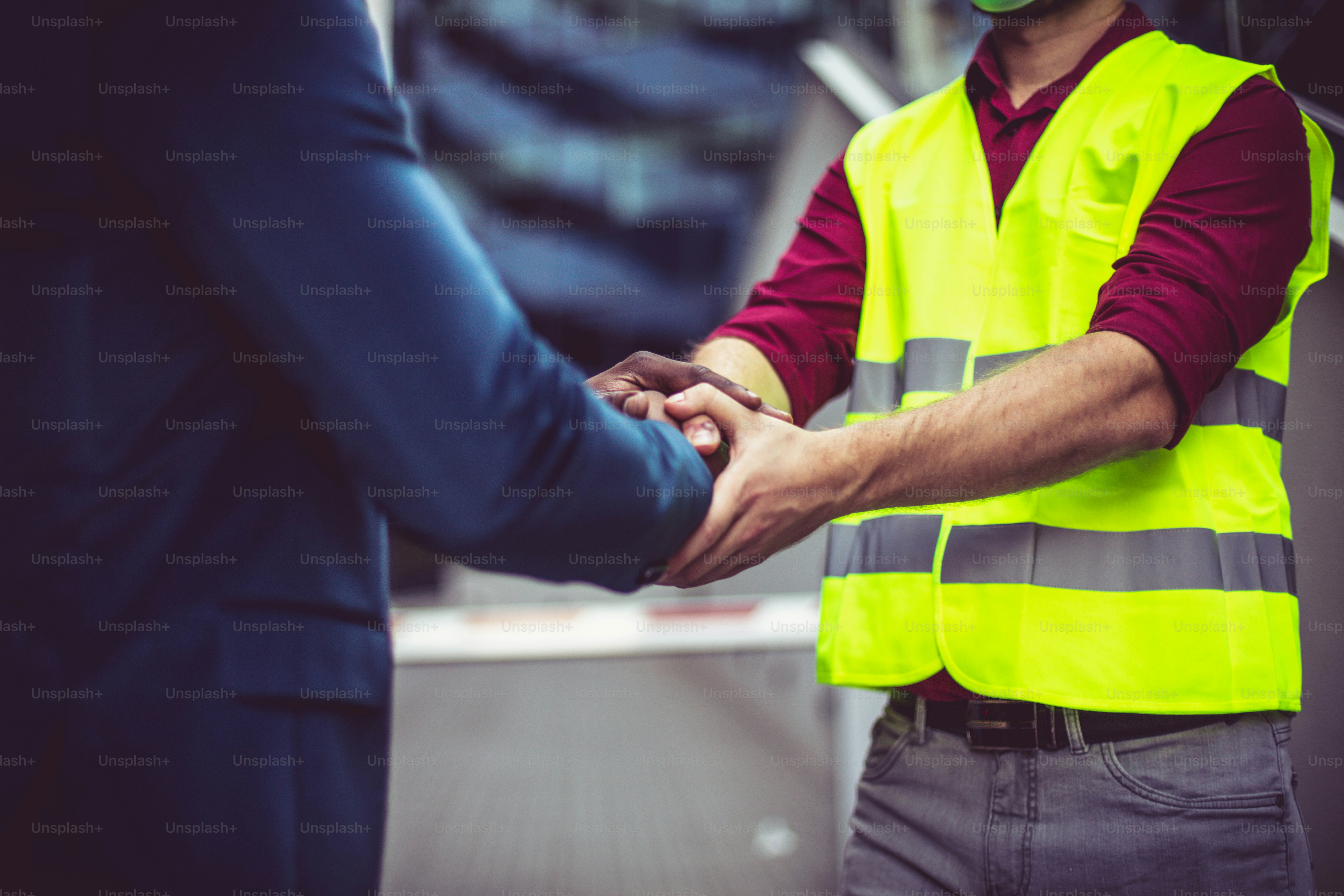 Two businessmen handshaking.   Focus is on hands.