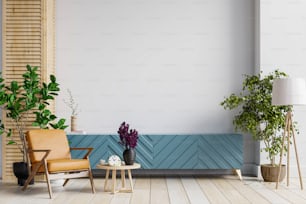 白い壁の背景に革張りのアームチェアと植物のあるモダンなリビングルームのモックアップキャビネット、3Dレンダリング