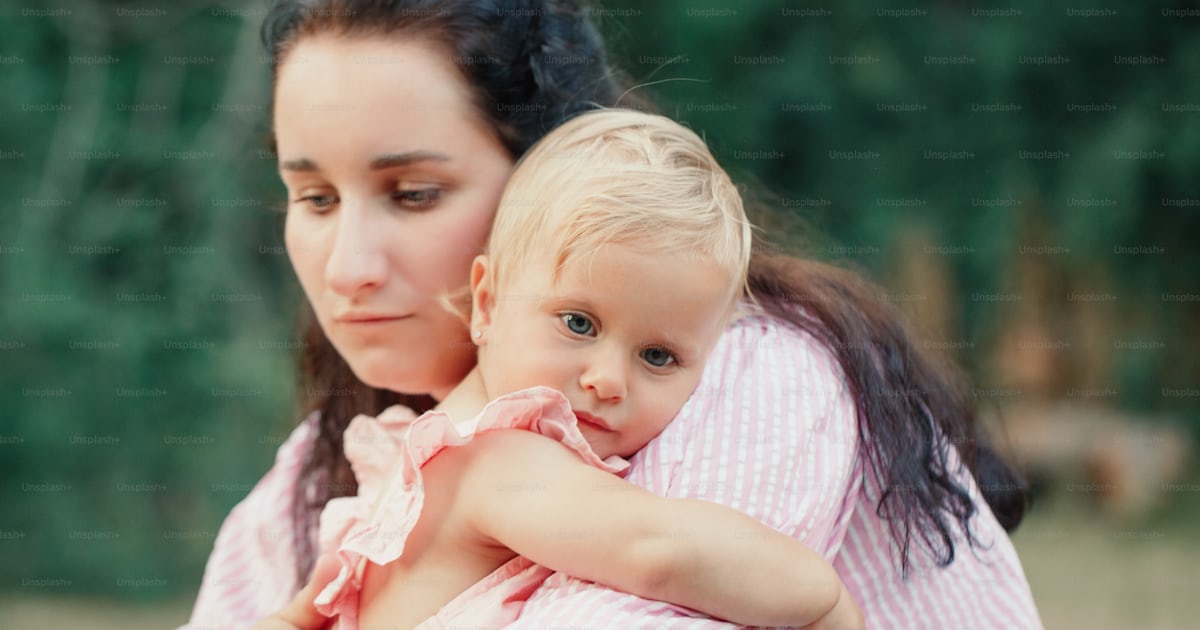 Mother hugging pacifying sad upset toddler girl. Family young mom and ...