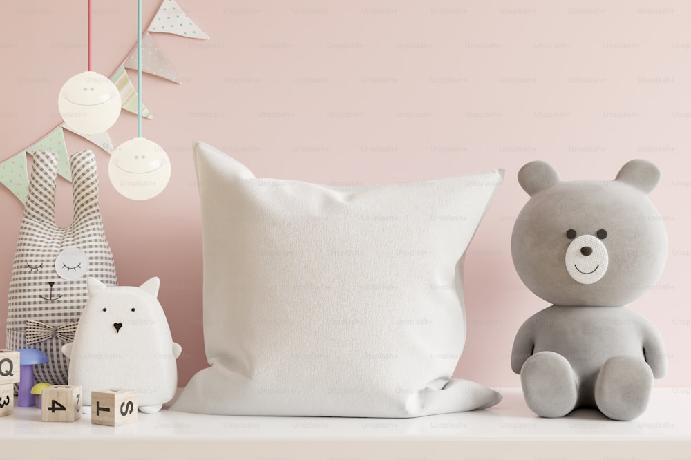 Mockup pillow in the children's room on light pink colors wall background.3D Rendering