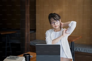 Female office worker relaxing at her workplace.