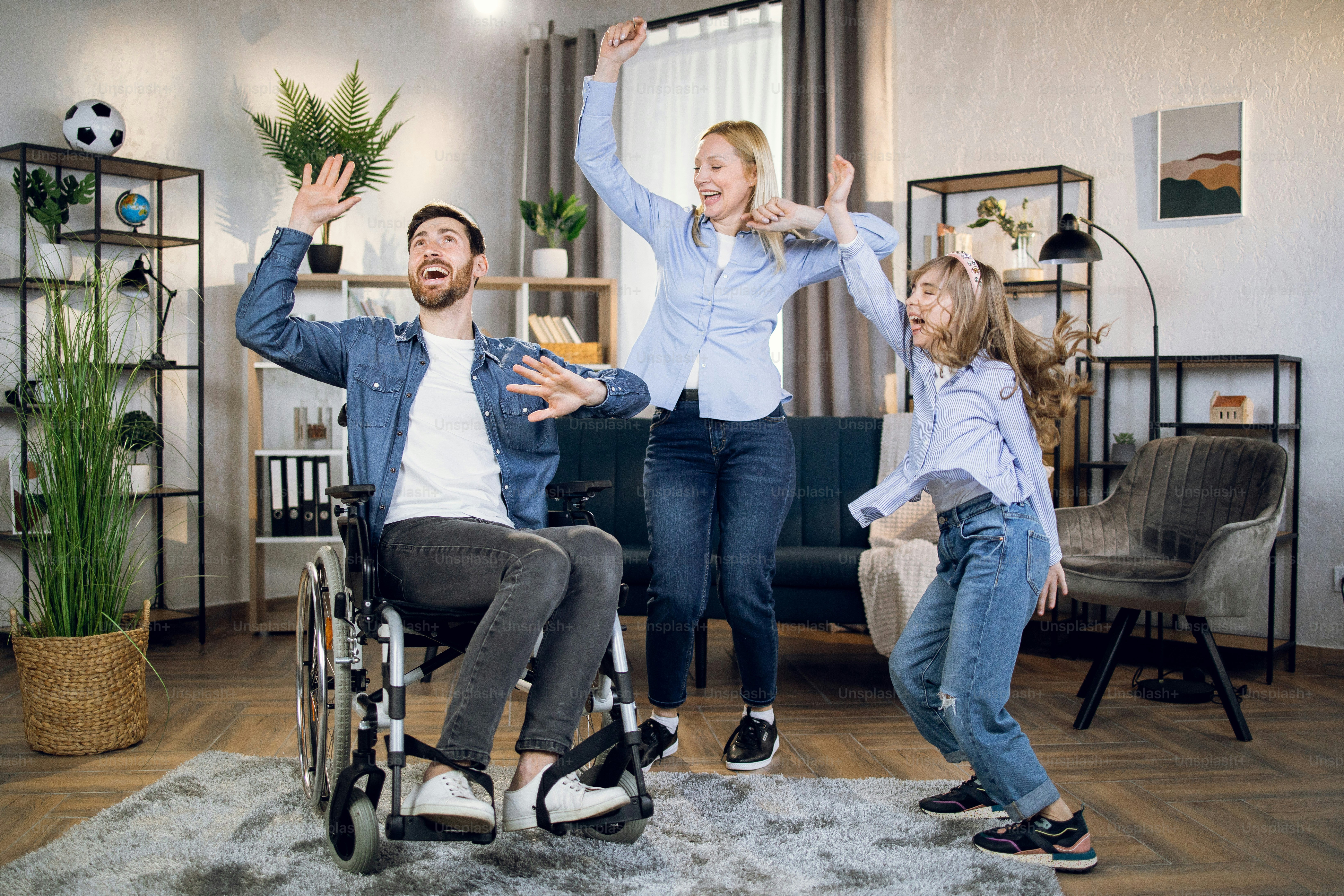 Happy woman in wheelchair dancing with beloved husband and pretty ...