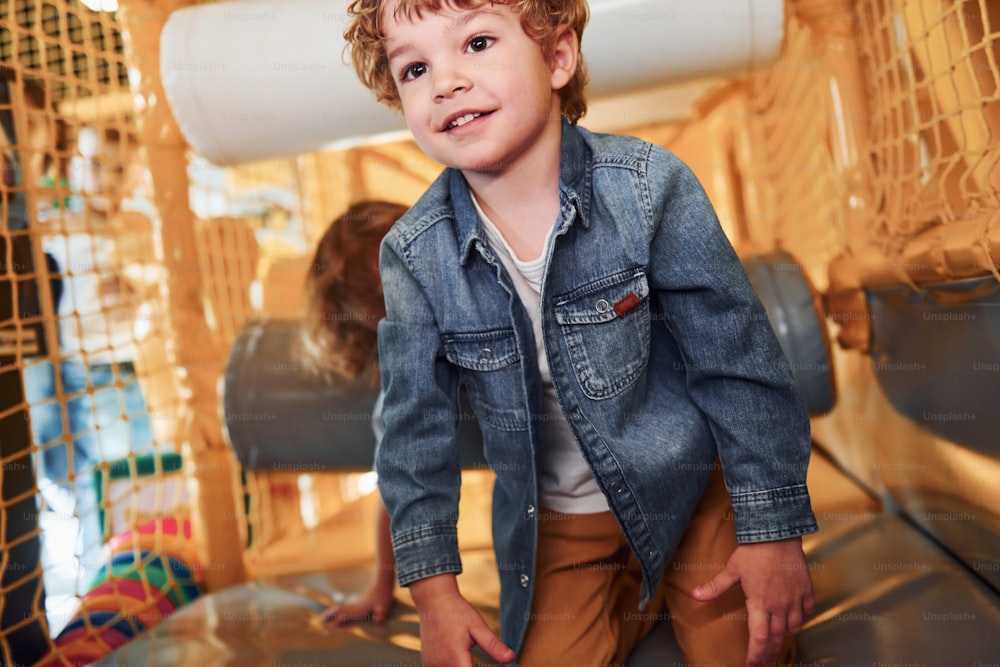 Children have fun in playroom together. Kindergarten games.