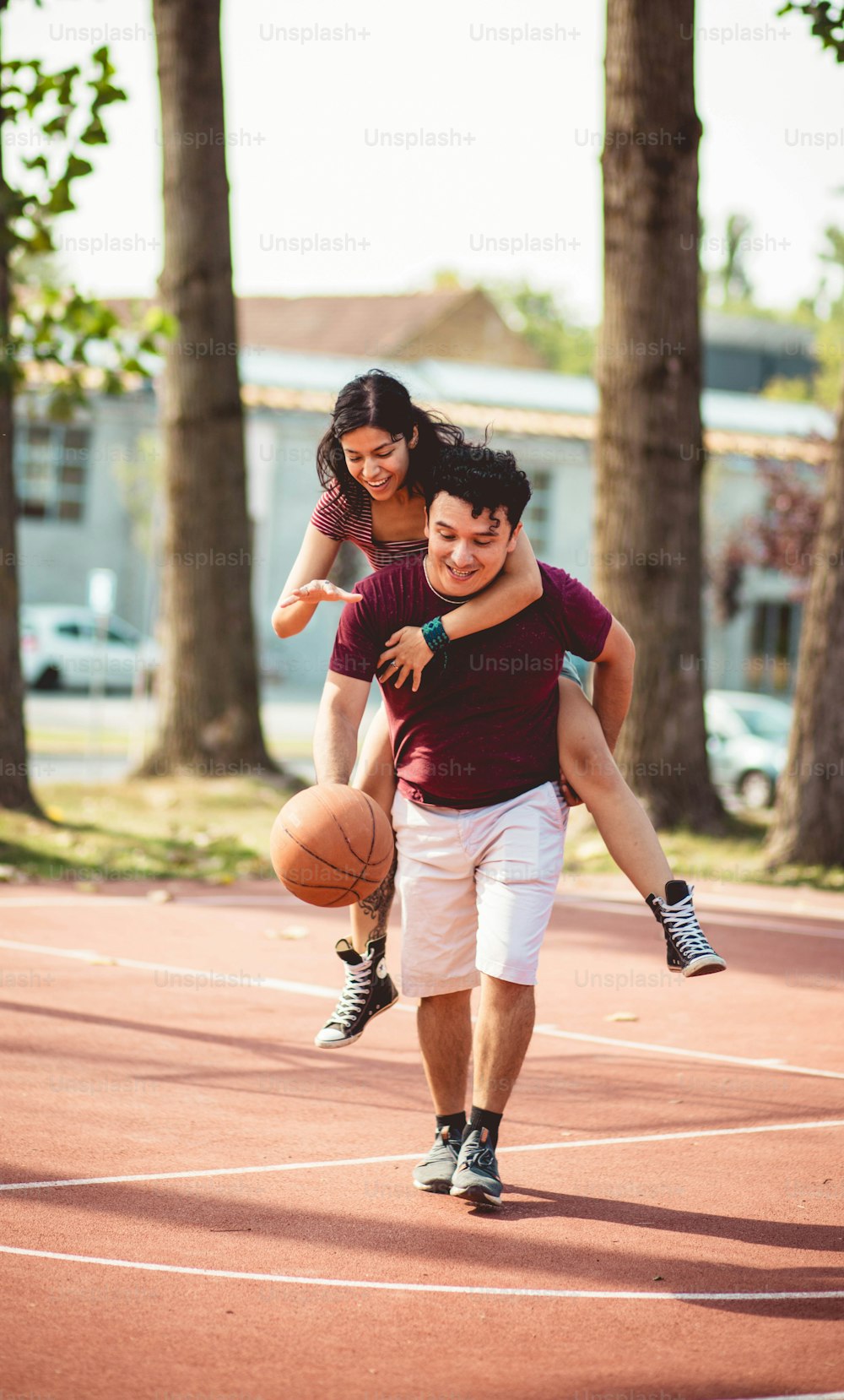 Young couple playing basketball.