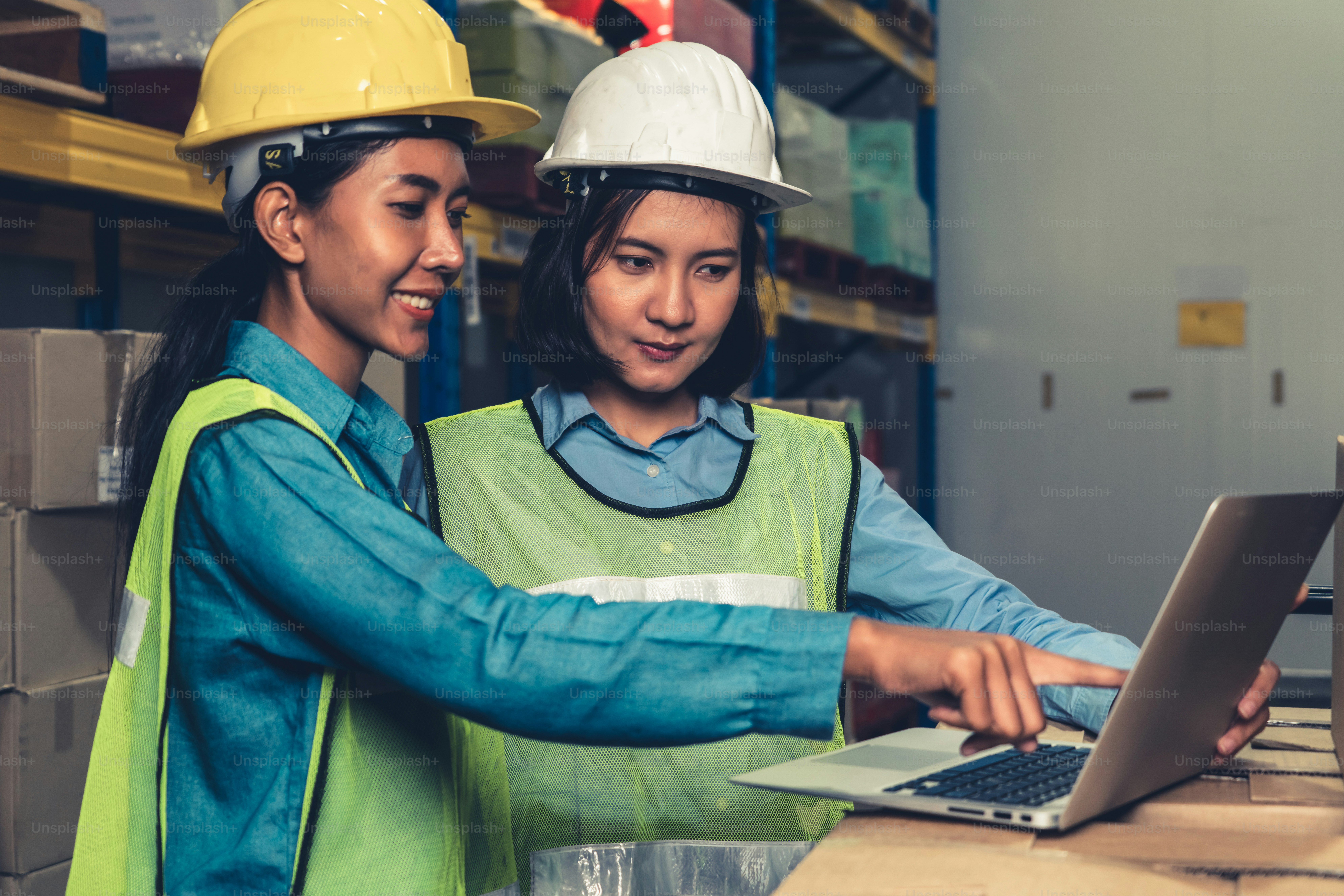 Female warehouse worker working at the storehouse . Logistics , supply