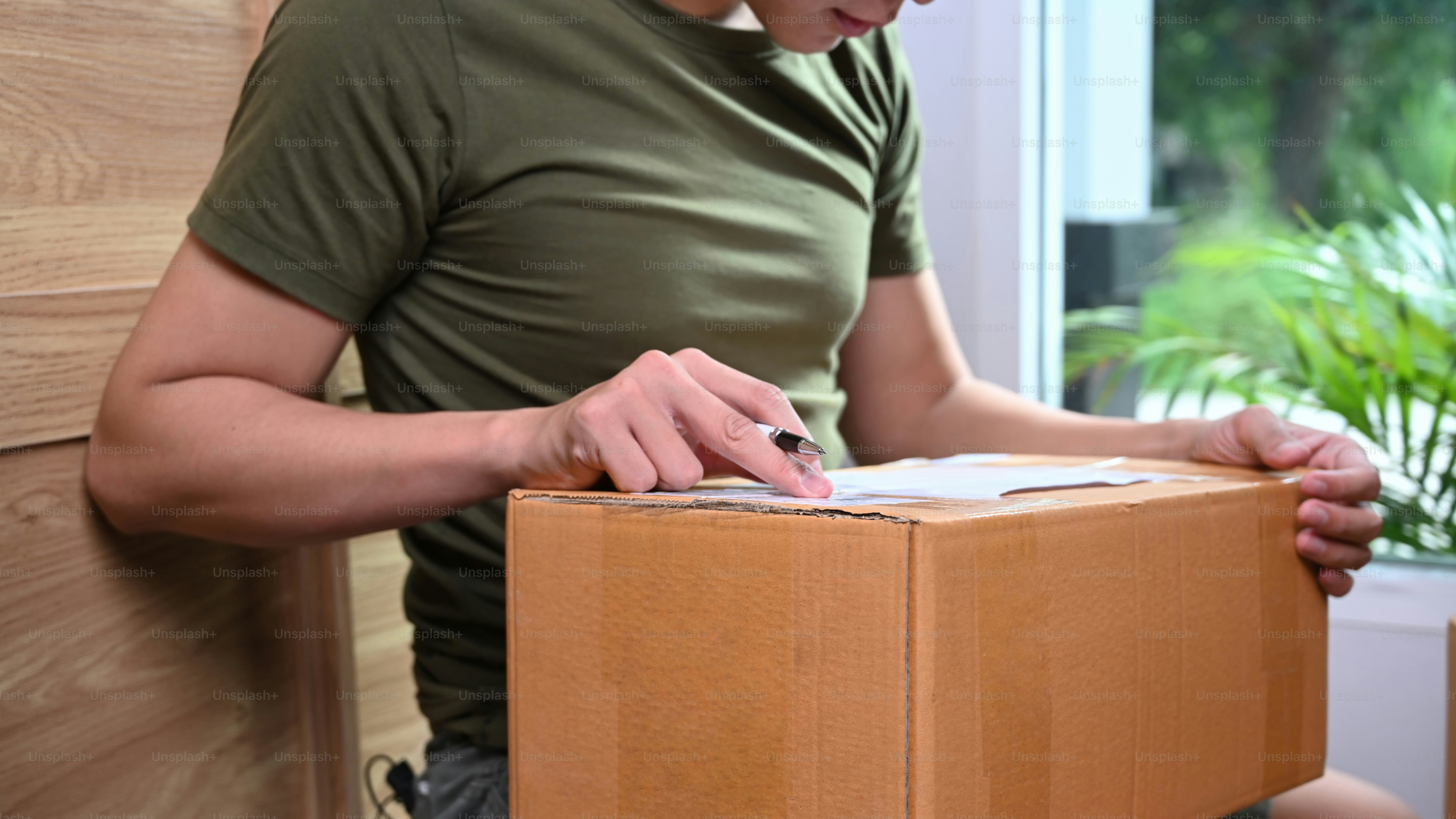 Small business owner preparing parcel box of product for deliver to customer. Online selling.