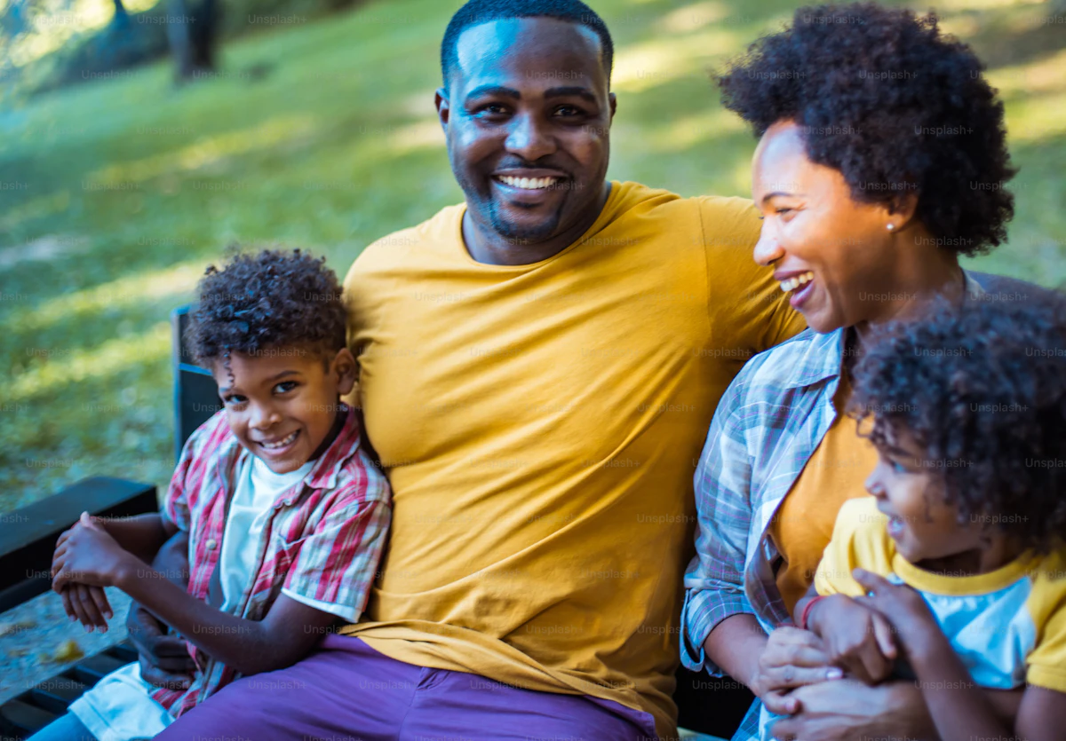 Portrait of a happy African American family outdoors