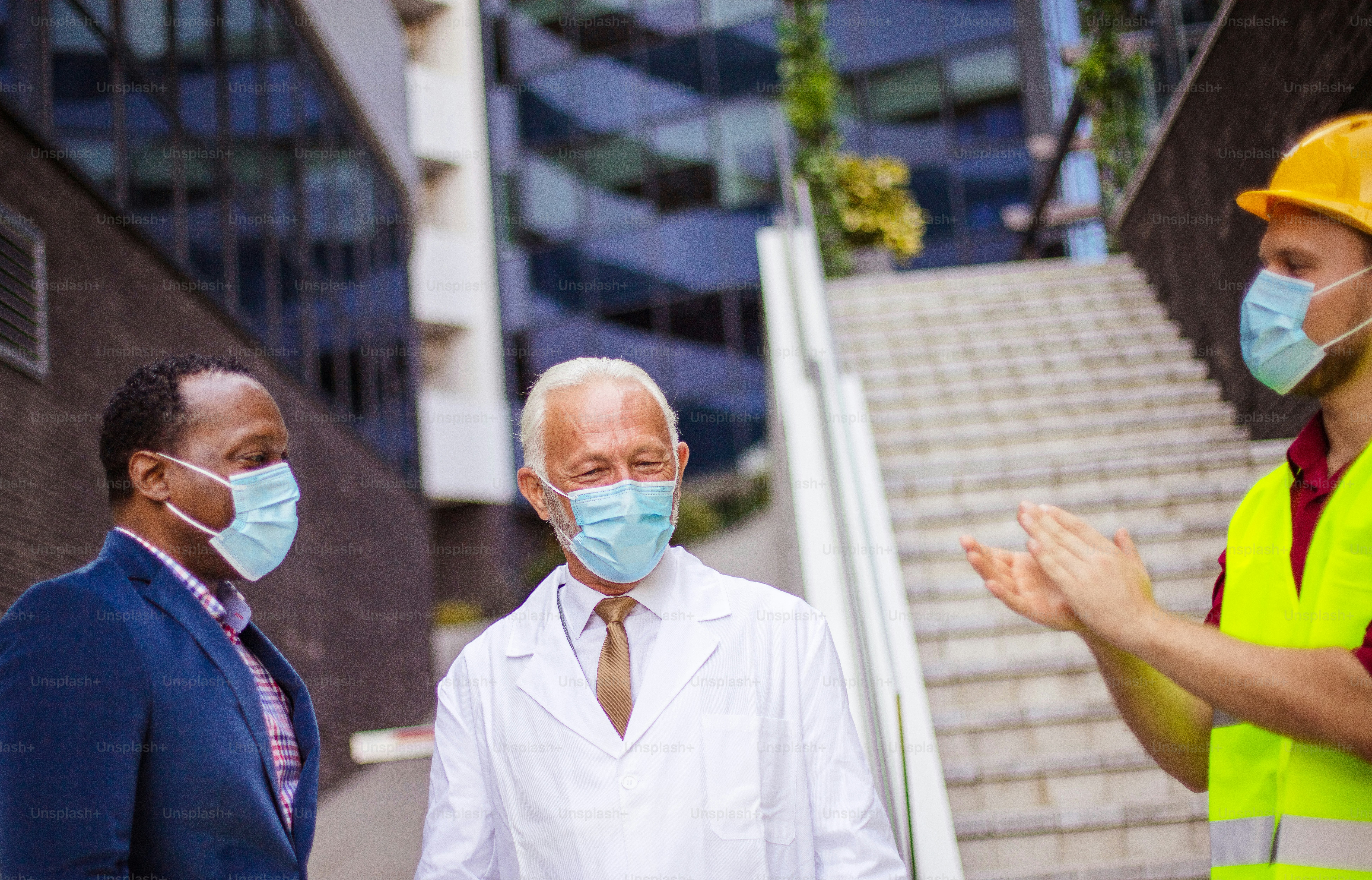 Business man, doctor and engineer on  street.
